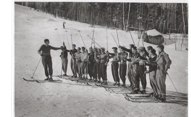 Black and White image of skier instruction