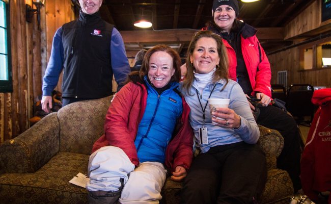 Women on couch with drinks