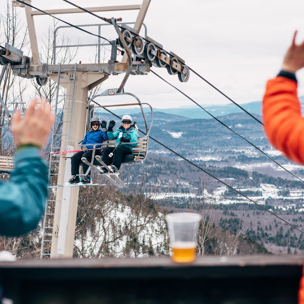 Waving to people on the chairlift