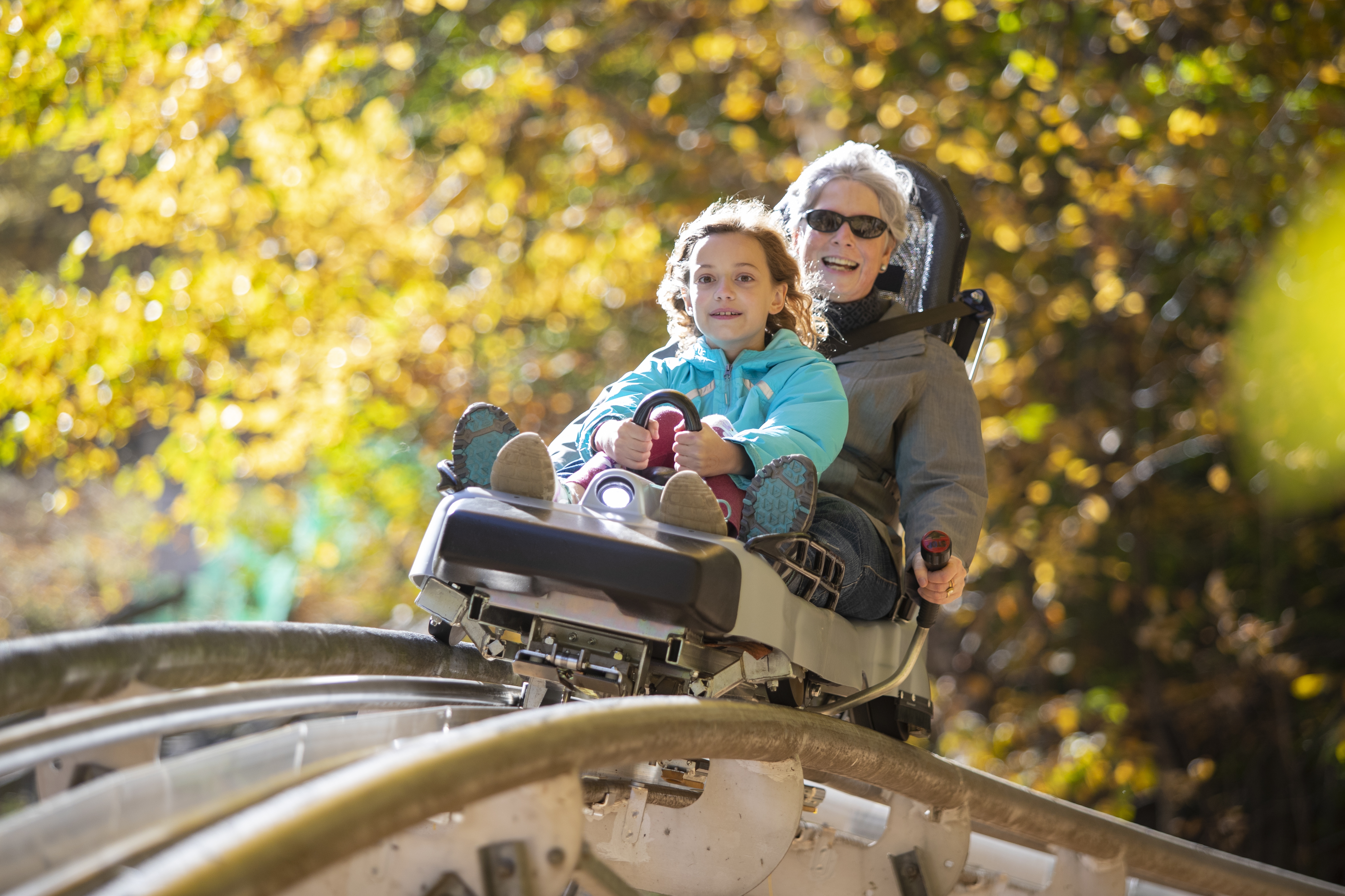 Parent and child on mountain coaster