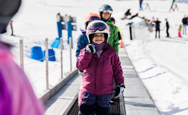 kids going up magic carpet