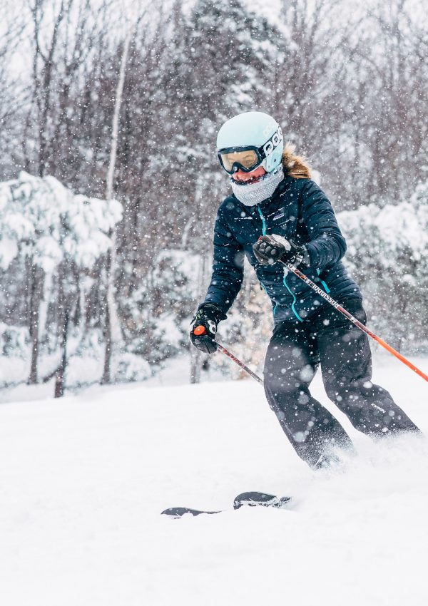 Female Skier Blue Jacket snowy day