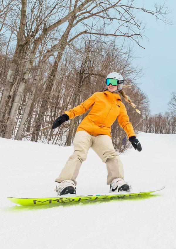 Snowboard Female vertical, orange jacket